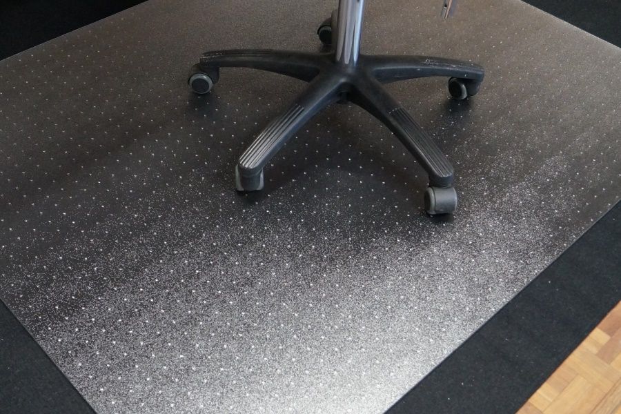 Chair underlayment with and without spikes