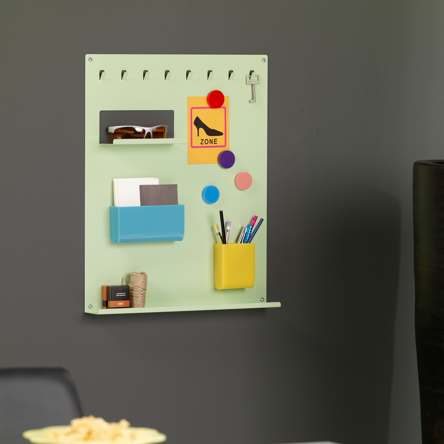 Green notice board and key holder with accessories